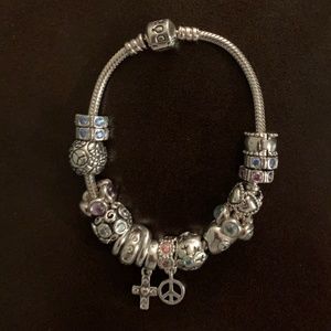 Sterling Silver Pandora Bracelet with 15 charms.